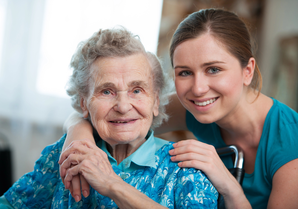 Depositphotos_11440750_S Smiling senior woman and palliative care nurse.