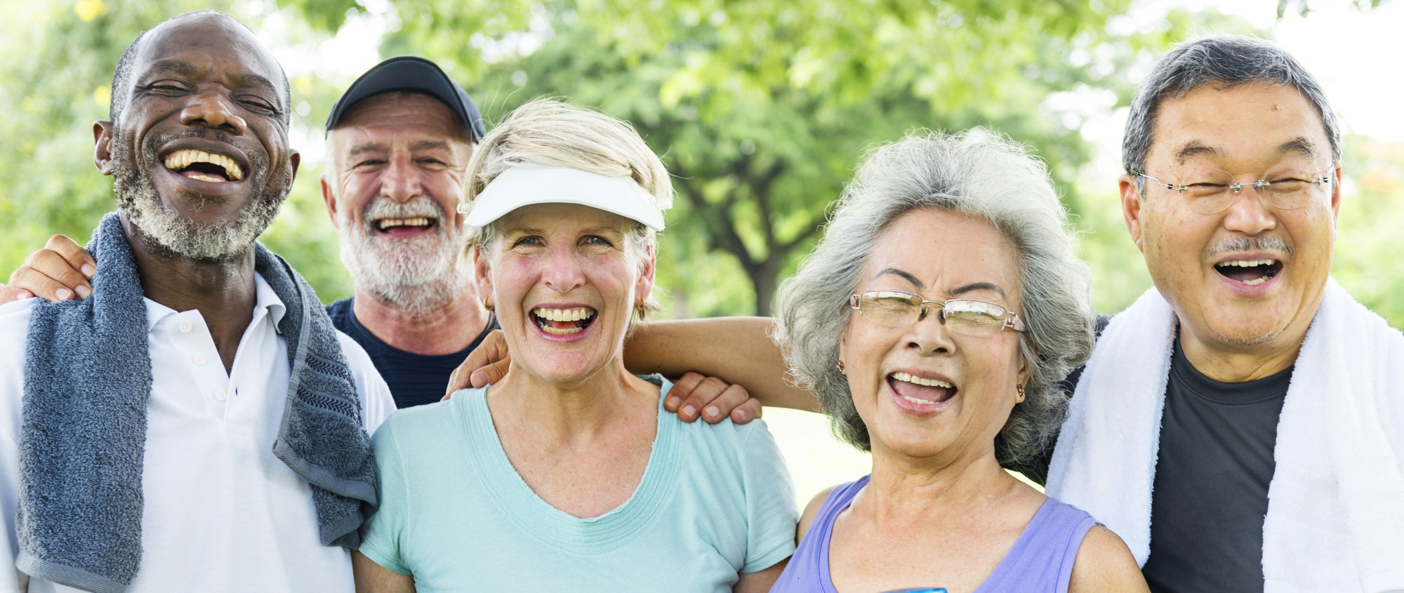 Depositphotos_129708902_L A group of older friends laughing together outdoors