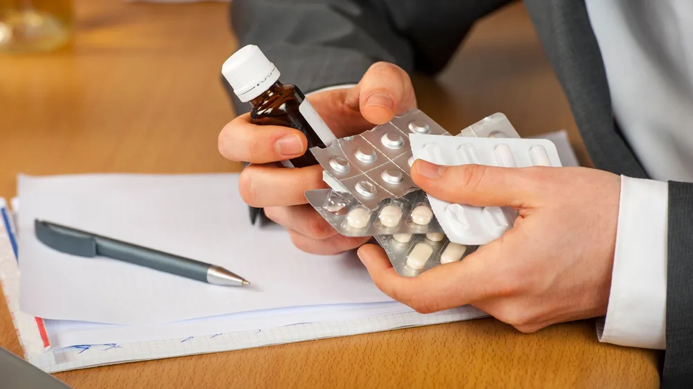 Care manager sorting through medication for a senior
