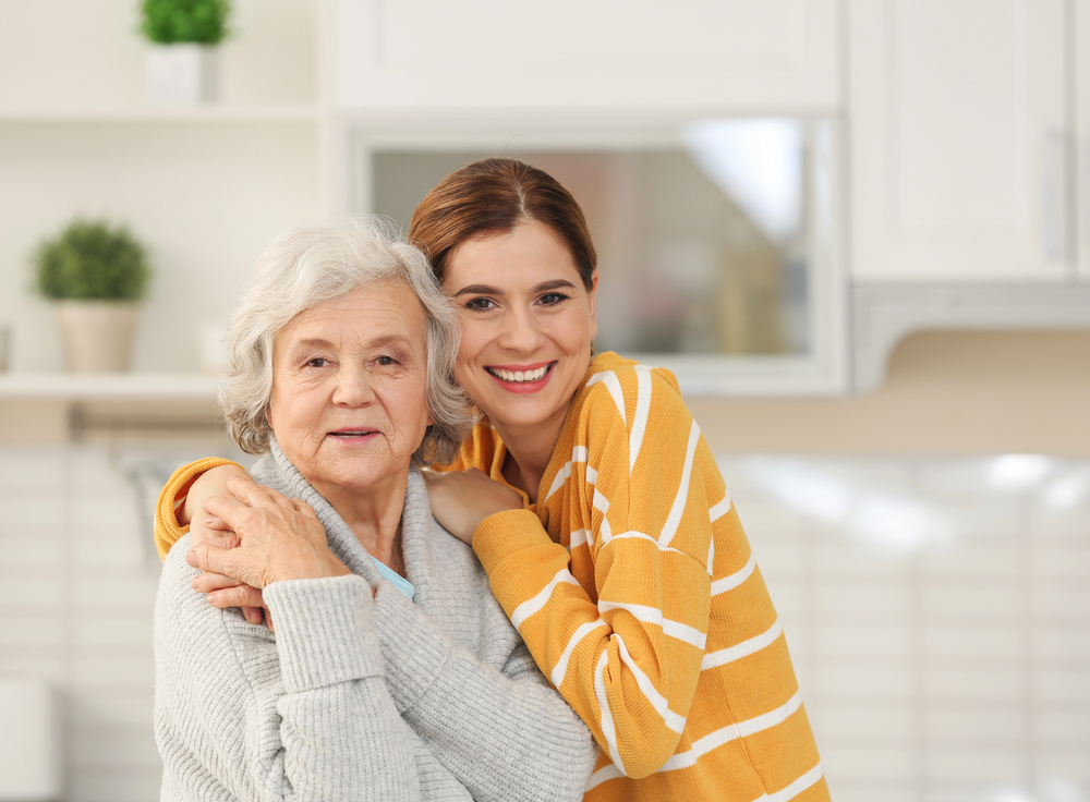 Smiling woman and daughter happy with their chronic care management plan.
