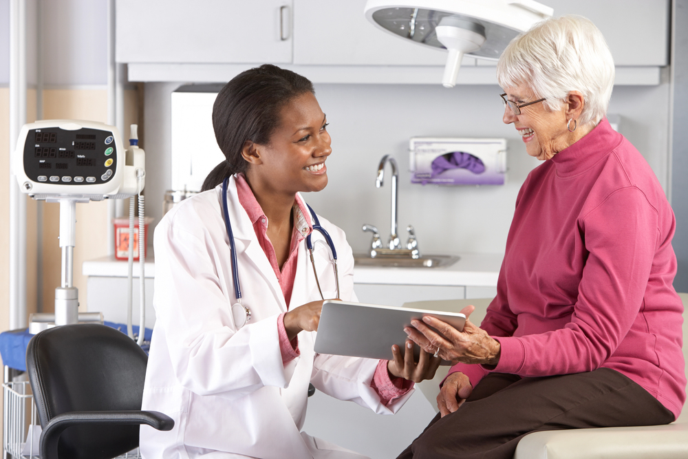Smiling doctor and patient in emergency room
