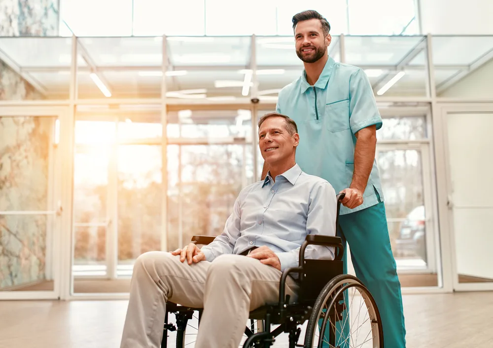 Depositphotos_439334948_S-1 A man with chronic illness being cared for by a concierge care manager