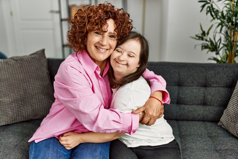 A happy care manager working with an adult with special needs. 